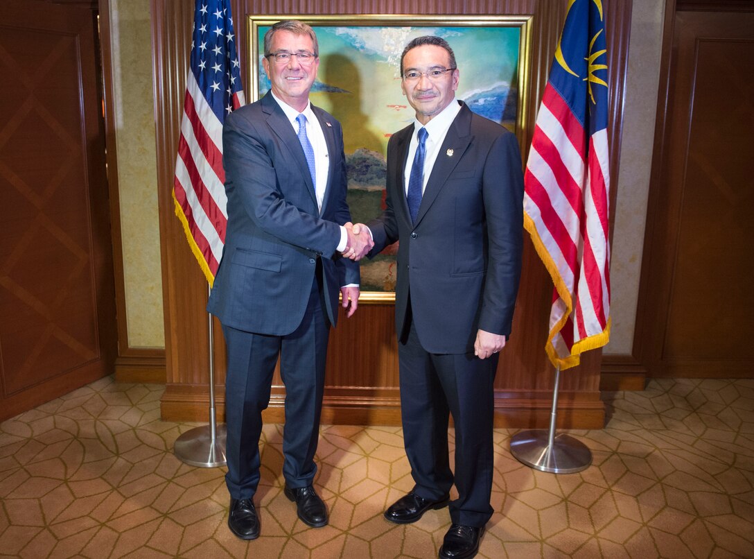 Defense Secretary Ash Carter greets Malaysian Defense Minister Hishammuddin Hussein prior to a bilateral meeting in Singapore, June 4, 2016. DoD photo by Navy Petty Officer 1st Class Tim D. Godbee