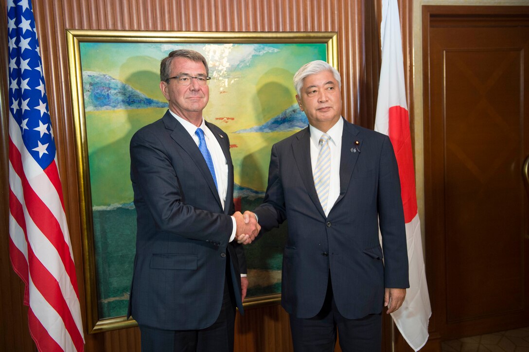 Defense Secretary Ash Carter shakes hands with Japanese Defense Minister Gen Nakatani prior to a bilateral meeting in Singapore, June 4, 2016.  DoD photo by Navy Petty Officer 1st Class Tim D. Godbee