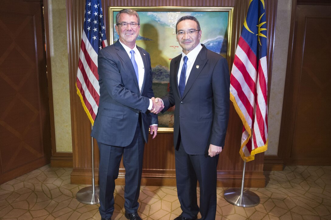 Defense Secretary Ash Carter greets Malaysian Defense Minister Hishammuddin Hussein prior to a bilateral meeting in Singapore, June 4, 2016. DoD photo by Navy Petty Officer 1st Class Tim D. Godbee