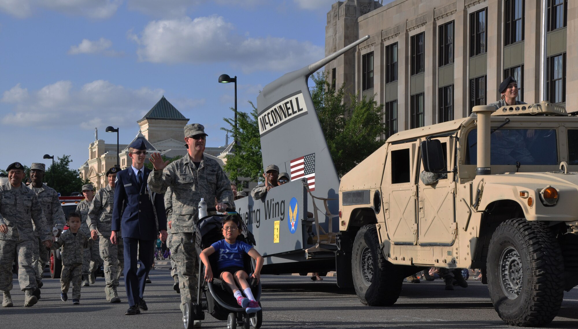 More than 30 Airmen from Team McConnell participated in the Sundown Parade to help kick off Wichita's 2016 Riverfest celebration on June 3. Team McConnell members took the opportunity throughout the parade to thank community members for their support! (U.S. Air Force photo by Tech. Sgt. Abigail Klein)