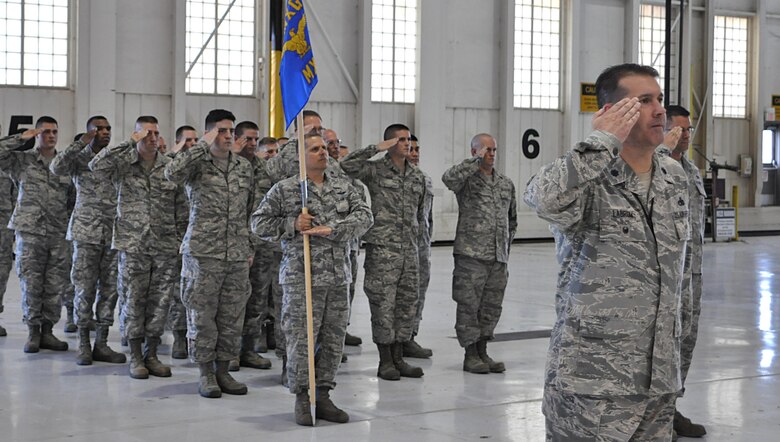 Lt. Col. Chris Labrum, 931st Maintenance Group deputy commander, leads a formation of 931 MXG Citizen Airmen in their first salute to their new commander, Col. Heath Fowler, during an activation and assumption of command ceremony June 4, 2016, in Hangar 1107 at McConnell Air Force Base, Kansas. The formation renders its first salute during the ceremony in recognition of the incoming commander’s authority. (U.S. Air Force photo by Senior Airman Preston Webb)