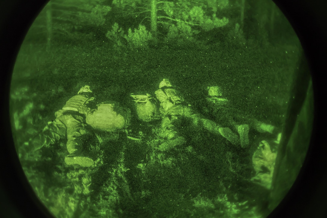 Soldiers provide security after being inserted on a simulated hot landing zone during a night air assault training mission at Fort Drum, New York, May 18, 2016. Air Force photo by Staff Sgt. Ryan Campbell
