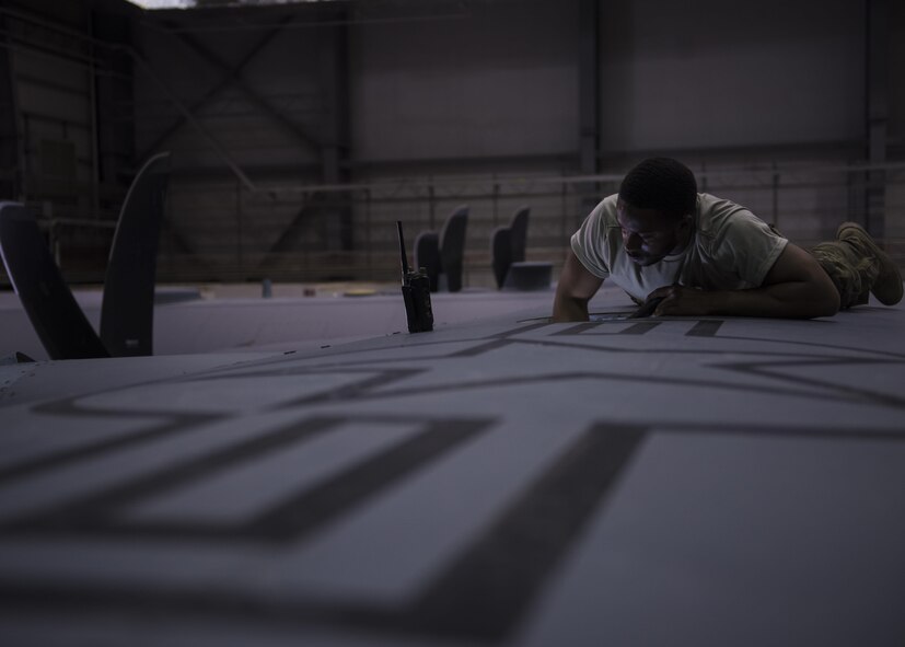 Senior Airman Shannon Wilson, 455th Expeditionary Aircraft Maintenance Squadron crew chief, inspects the inside of a C-130J Super Hercules wing at Bagram Airfield, Afghanistan, June 04, 2016. Members of the 455th EAMXS ensure that aircraft at Bagram are prepared for flight and return them to a mission-ready state once they land. (U.S. Air Force photo by Senior Airman Justyn M. Freeman)