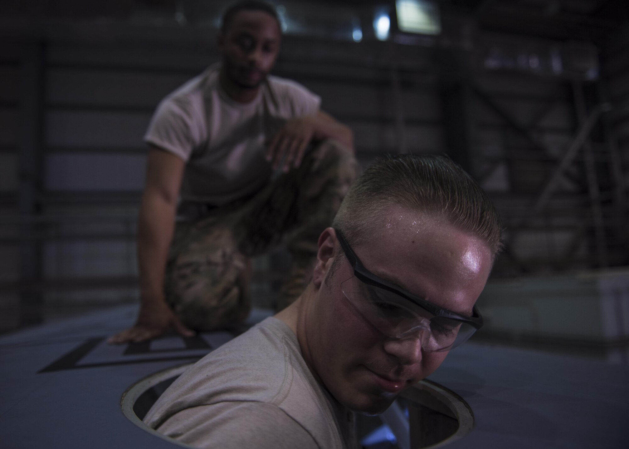 Senior Airman Spencer Kennedy, 455th Expeditionary Aircraft Maintenance Squadron aircraft metals technology technician, maneuvers into a wing on a C-130J Super Hercules to inspect the inside at Bagram Airfield, Afghanistan, June 04, 2016. Members of the 455th EAMXS ensure aircraft at Bagram are prepared for flight and return them to a mission-ready state once they land.  (U.S. Air Force photo by Senior Airman Justyn M. Freeman)