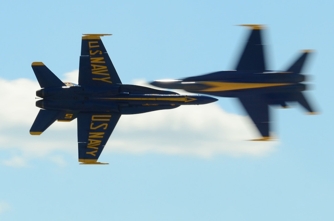 A photo of U.S. Navy Flight Demonstration Squadron -- also known as the Blue Angels -- pilots performing the Opposing Knife Edge Pass in Fort Worth, Texas, April 22, 2016. Marine Corps Capt. Jeff Kuss, the pilot of a Navy F/A-18C Hornet and a member of the Blue Angels flight demonstration squadron, died at the start of a practice flight when his aircraft crashed in Smyrna, Tennessee, June 2, 2016. Navy photo by Petty Officer 2nd Class Jason Howard