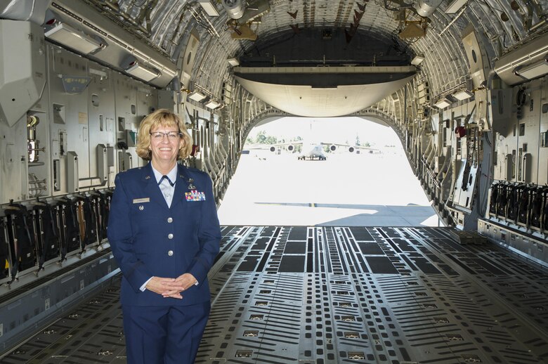 Col. Maureen Carroll, 446th Aircraft Maintenance Squadron commander, poses for a photo in a C-17 Globemaster III on the Joint Base Lewis-McChord flight line before her promotion ceremony June 4, 2016. Carroll will leave the 446th Airlift Wing to be the individual mobilization augmentee to the Air Force Network Integrations Center commander. The AFNIC, located at Scott Air Force Base, Ill., is the Air Force's premier organization for Air Force Network integration, cyber simulation, and network standards, architecture and engineering services. Carroll originally enlisted in 1979 and joined the 446th Maintenance Group 10 years later as a crew chief. She was commissioned in 1995 and fulfilled many roles in the 446th AMXS and 446th Maintenance Squadron. (U.S. Air Force Reserve photo by Staff Sgt. Madelyn McCullough)