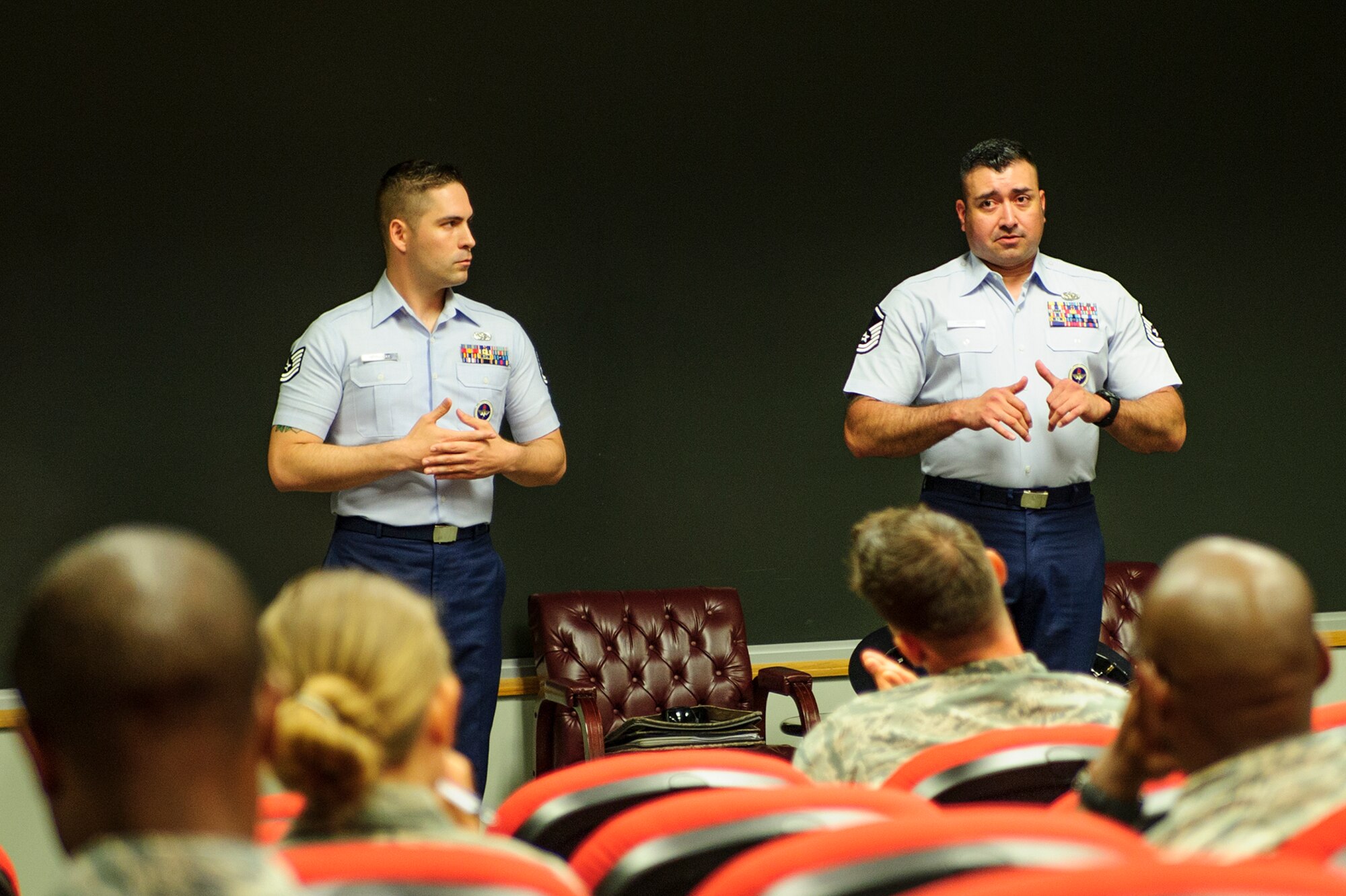 Tech. Sgt. Robert Hemingway and Master Sgt. Jose Rodriguez, both military training instructors with the 433rd training squadron at JB San Antonio-Lackland, Texas, provide information to instrested MTI canidates during a briefing June 5, 2016 at Joint Base Charleston, South Carolina. The MTI recruiting team was conducting a nationwide search for new military training instructors from the Air Force Reserve (U.S. Air Force photo by Senior Airman Jonathan Lane).