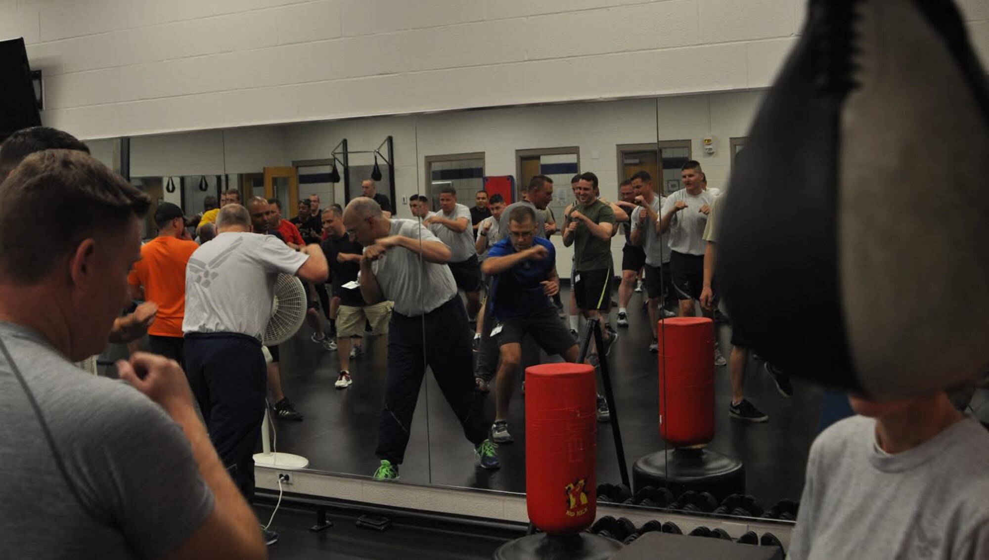 Citizen Airmen with the 931st Air Refueling Wing workout together during Wingman Day, which focused on resiliency, June 5, 2016, at McConnell Air Force Base, Kans. Since physical and mental health share a strong link, Airmen spent the day training together to build their bodies and social connections. (U.S. Air Force photo by Senior Airman Preston Webb)