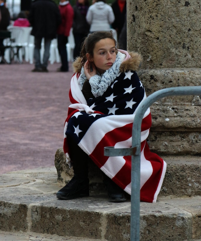 Marie Dulas, a 13-year-old French girl, watches the 82nd Airborne Division Band perform a free concert in Sainte Mere Eglise, France on June 3, 2016, in honor of the 72nd anniversary of D-Day. Army photo by Capt. Joe Bush