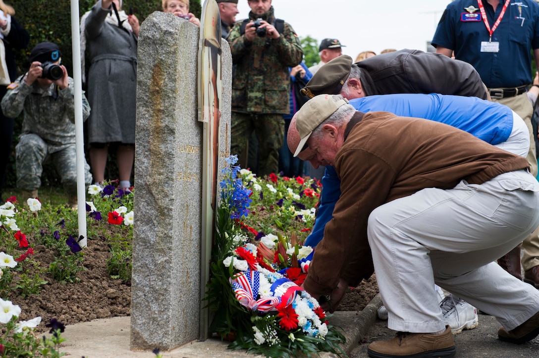 Participants lay ceremonial wreaths at the 90th Infantry Division Memorial Ceremony to commemorate D-Day in Picauville, France, June 3, 2016. Navy photo by Petty Officer 1st Class Sean Spratt 