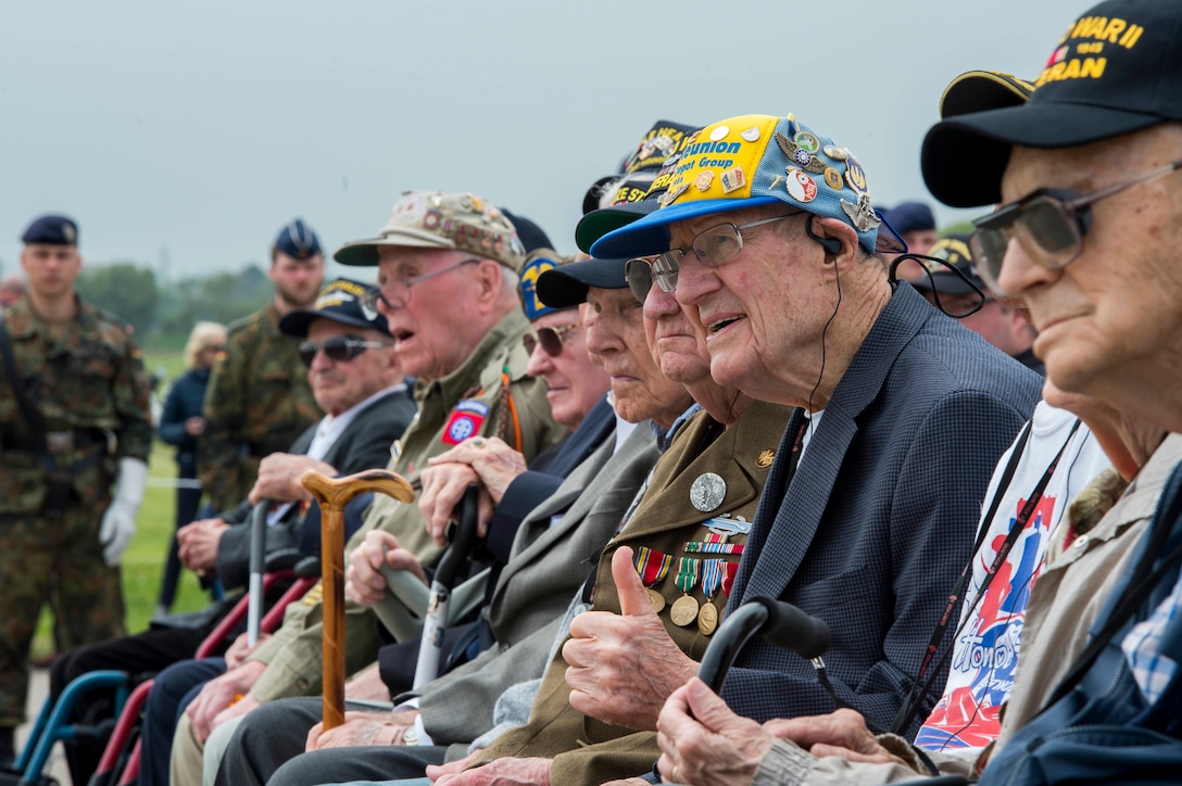 D-Day veterans listen during the Utah Beach Memorial Ceremony in Normandy, France, June 4, 2016. Navy photo by Petty Officer 1st Class Sean Spratt