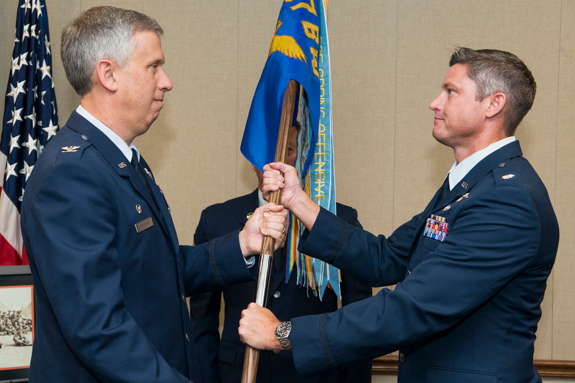 U.S. Air Force Col. Robert Burgess, the commander of the 307th Operations Group, presents the 93rd Bomb Squadron guidon to Lt. Col. Brent Weisner during a change of command ceremony at Barksdale Air Force Base, La. on June 3, 2016. The passing of the guidon is a symbol of the transfer of responsibility and authority of the squadron to Weisner as he becomes the new squadron commander. (U.S. Air Force photo by Master Sgt. Greg Steele/Released)