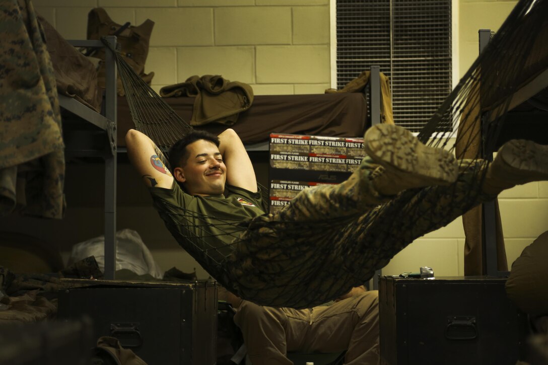 Cpl. Anthony Felicetti watches a movie after a training day, May 13, 2016, at Camp Rodriguez Live Fire Complex, South Korea. Felicetti is an engineer equipment operator and participated in the range construction in order to efficiently transport personnel and demolition during Korea Explosive Ordnance Disposal Exercise. Felicetti is from Upper Darby, Pa., and is attached to Support Company, 9th Engineer Support Battalion, 3rd Marine Logistics Group, III Marine Expeditionary Force. (U.S. Marine Corps photo by Cpl. Isaac Ibarra/Released)
