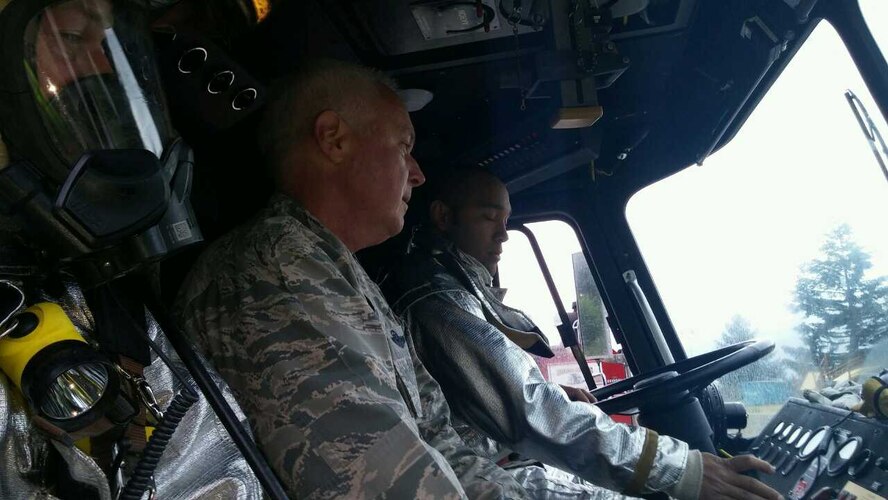 Staff Sgt. Mathew Kahai, a firefighter with the 446th Civil Engineer Squadron, shows Col. Scott McGlaughlin, 446th Airlift Wing commander, how to operate the vehicle during training May 15, 2016, at Joint Base Lewis-McChord. The two-day training provided an opportunity for 23 firefighters to gain valuable training in fire suppression, proper search and rescue techniques, and victim egress training. (U.S. Air Force Reserve photo by Tech. Sgt. Scott Matthews)