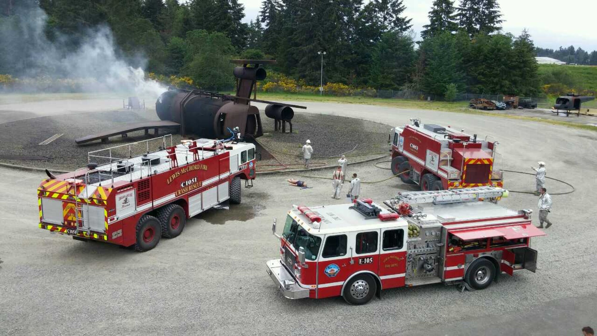 U.S. Air Force Reserve Firefighters, assigned to the 446th Civil Engineer Squadron, combat interior fires on a mock aircraft May 15, 2016, at Joint Base Lewis-McChord. Citizen Airmen participated in a two-day exercise consisting of fire suppression, search and rescue, and victim egress training. (U.S. Air Force Reserve photo by Tech. Sgt. Scott Matthews)