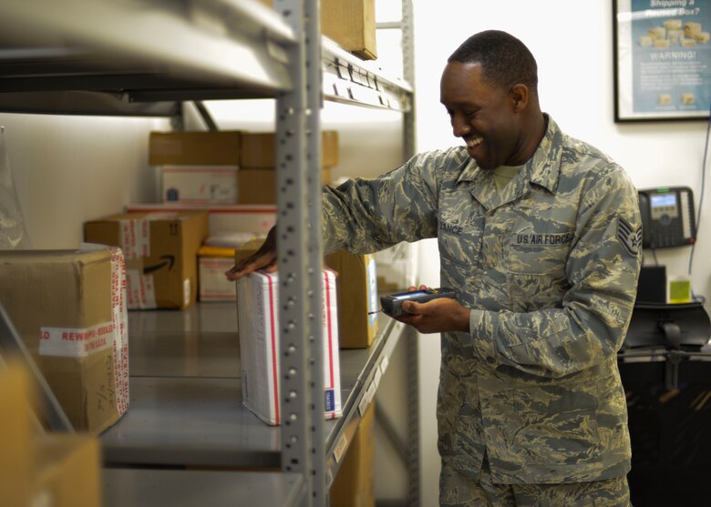 Staff Sgt. Ray Lance, 51st Communications Squadron official mail manager, scans a package destined for the base chapel at Osan Air Base, Republic of Korea, June 3, 2016. The official mail managers are responsible for sorting through and ensuring the proper delivery of all official mail sent to various organizations around base. (U.S. Air Force photo by Senior Airman Victor J. Caputo/Released)