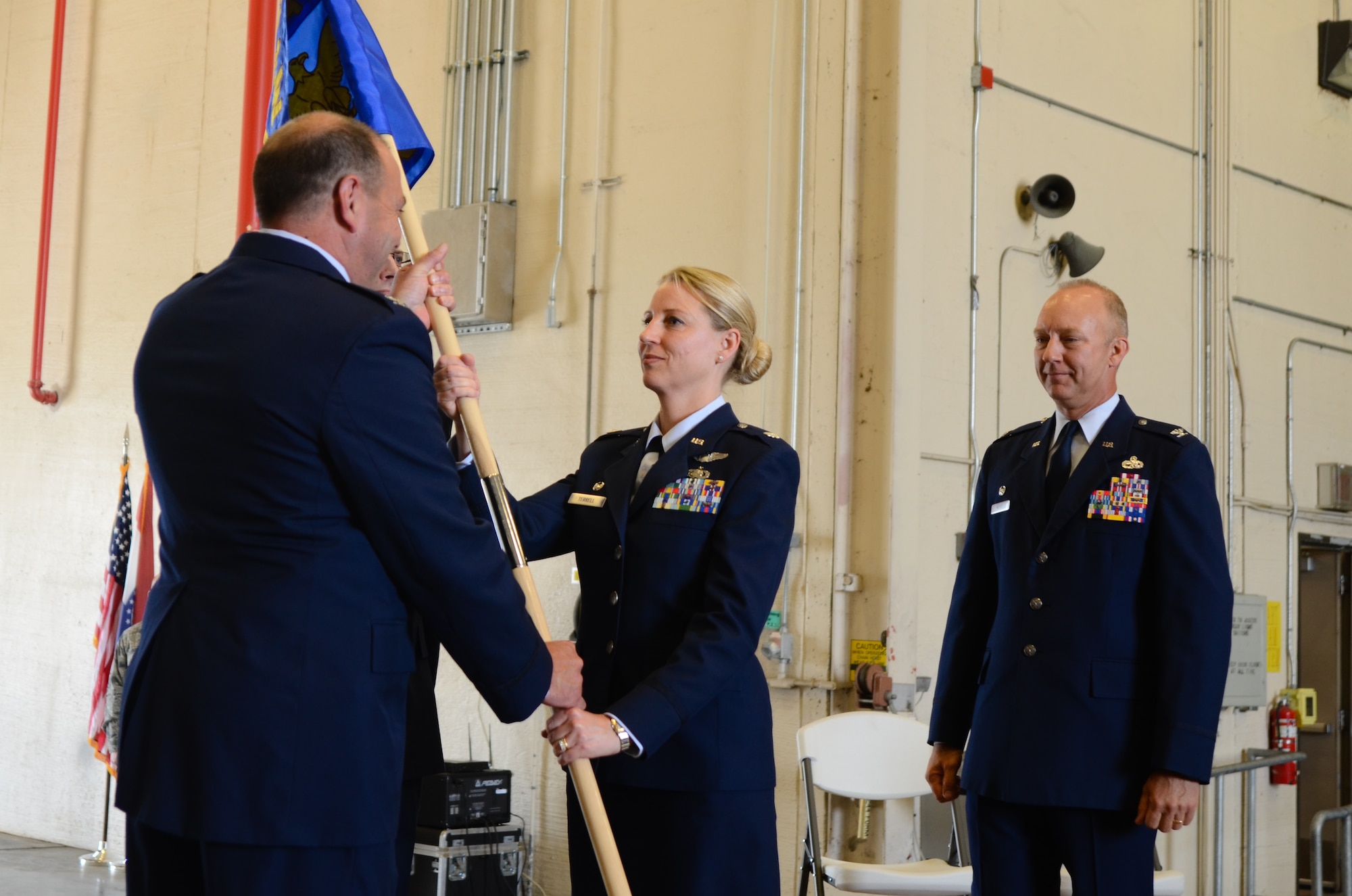 U.S. Air Force Lt. Col. Bryony A. Terrell (center) assumes command of the 139th Mission Support Group during a change of command ceremony at Rosecrans National Guard Base, St. Joseph, Mo., June 4, 2016. The outgoing group commander, Col. Gordon Meyer (right), has been selected to attend the U.S. Air Force Air War College at Maxwell Air Force Base, Ala. (U.S. Air National Guard photo by Tech. Sgt. Michael Crane/released)
