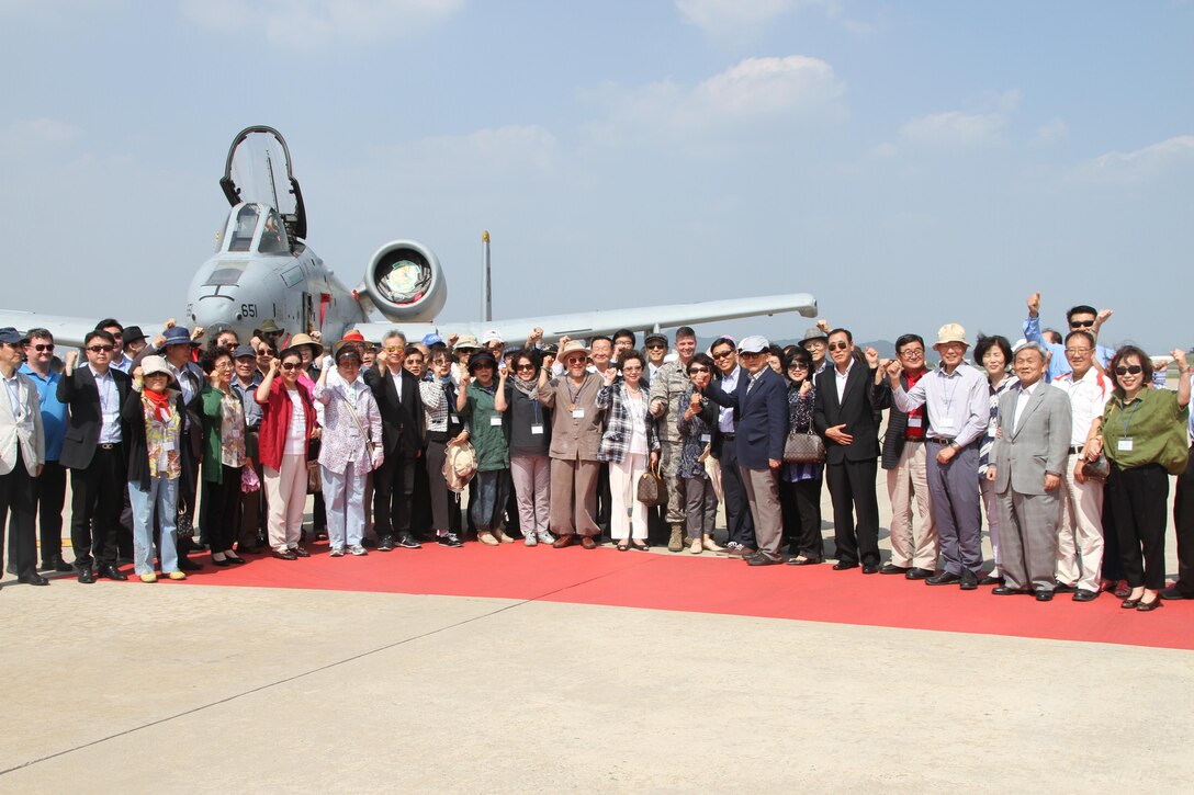 Members of the Korean American Society and the People to People International pose for a photo at Osan Air Base in front of an A-10. The groups toured U.S. bases in Osan and Pyeongtaek as part of the Executive Orientation Program II. They learned about U.S. Army's plan to relocate troops and their famillies from Seoul to Camp Humphries. 