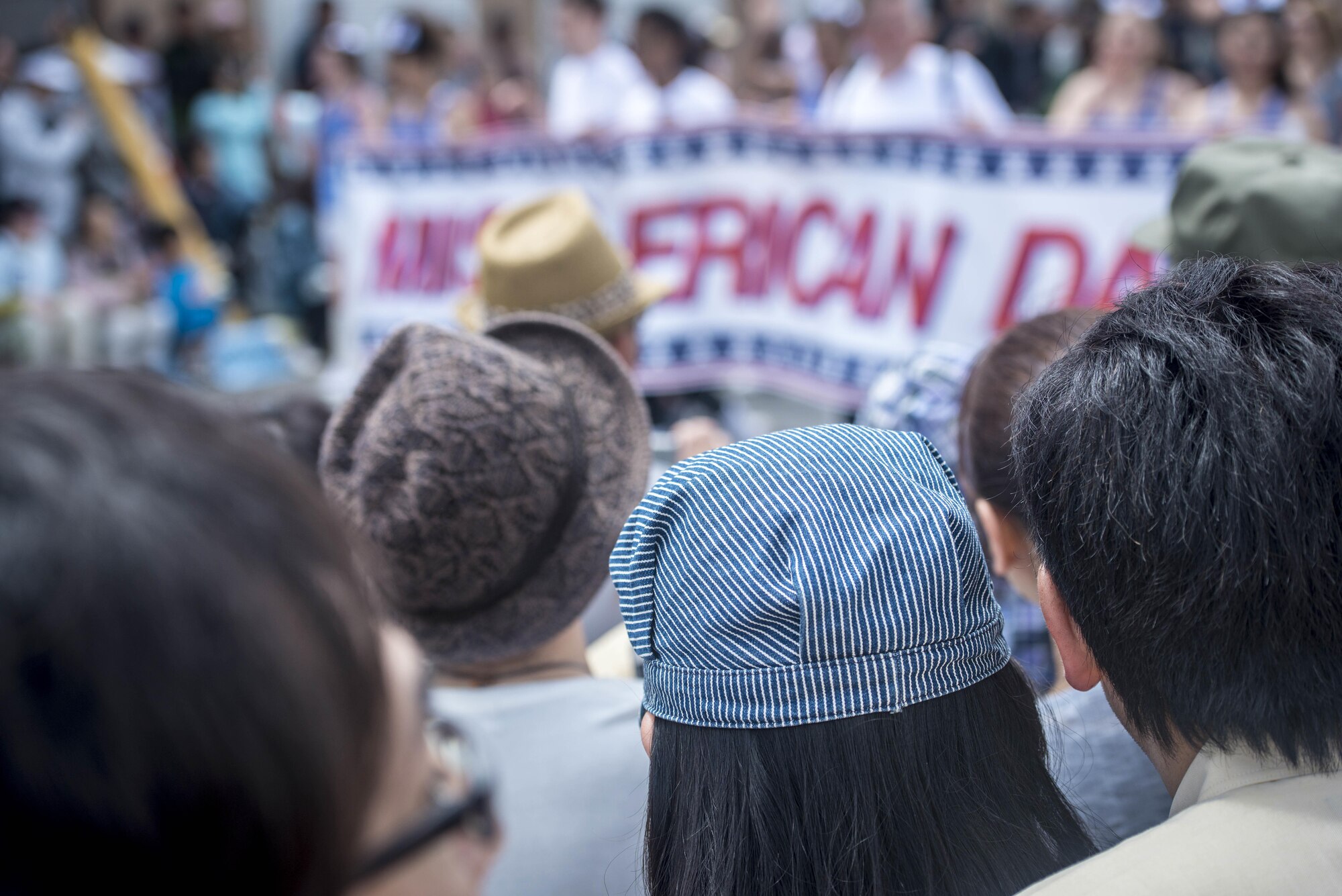 Japanese and Americans line the street, shoulder-to-shoulder, watching as the 28th Annual American Day parade banner marches past in Misawa City, Japan, June 5, 2016. Events like these are important as they afford Misawa neighbors, American and Japanese alike, opportunities to interact in a relaxed environment specifically planned for building friendships. More than 80,000 attendees from across the Aomori Prefecture traveled to Misawa City to enjoy American and Japanese culture. (U.S. Air Force photo by Staff Sgt. Benjamin W. Stratton)