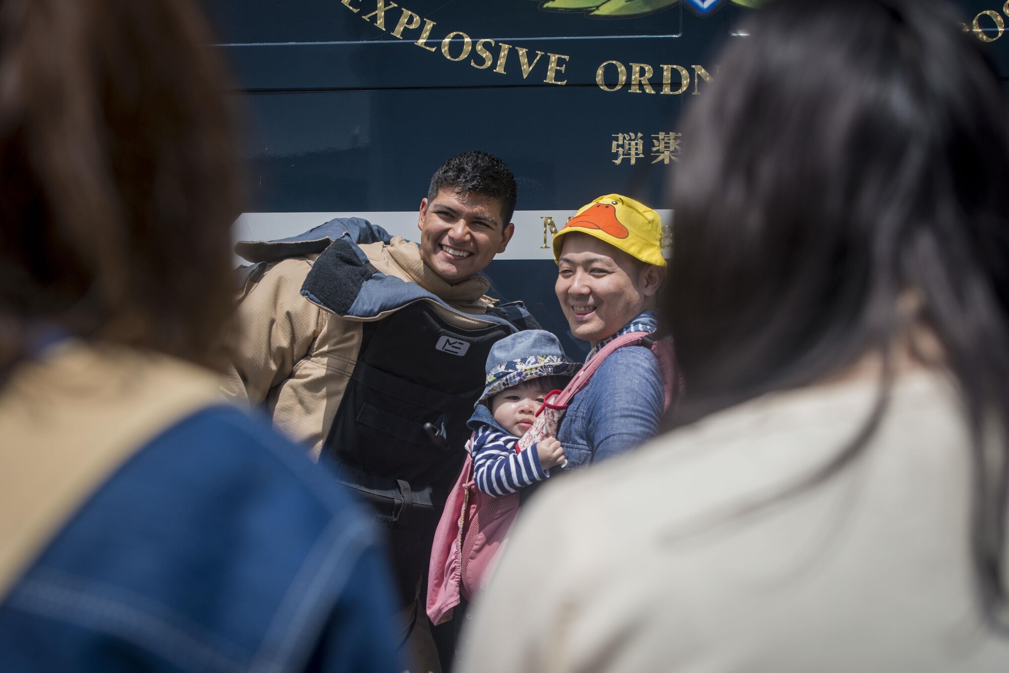 U.S. Air Force Senior Airman Manuel Carvajal, an explosive ordnance disposal journeyman with the 35th Civil Engineer Squadron, smiles as he poses for a photo in his bomb suit with Japanese residents from across the Aomori Prefecture during the 28th Annual American Day in Misawa City, Japan, June 5, 2016. In a showcase of the region’s bilateral partnership among U.S. military and Japanese citizens, more than 80,000 attendees enjoyed live performances, including Sublime with Rome, indulging in American and Japanese cuisine and strengthening international bonds. Carvajal is a Lorraine, Texas, native. (U.S. Air Force photo by Staff Sgt. Benjamin W. Stratton)