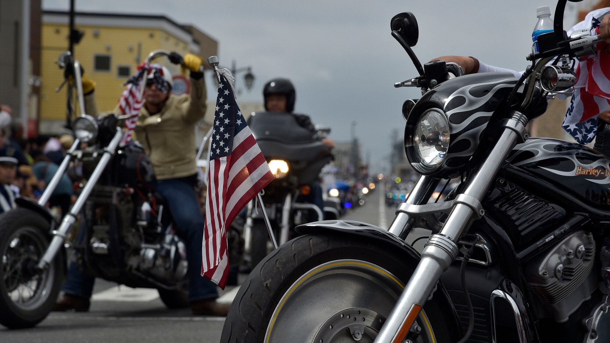 An American flag is displayed on the wheel of a motorcycle during the 28th Annual American Day parade in Misawa City, Japan, June 5, 2016. Events like these are important as they afford Misawa neighbors, American and Japanese alike, opportunities to interact in a relaxed environment specifically planned for building friendships. More than 80,000 attendees enjoyed live performances, including Sublime with Rome, indulging in American and Japanese cuisine and strengthening international bonds. (U.S. Air Force photo by Senior Airman Deana Heitzman)