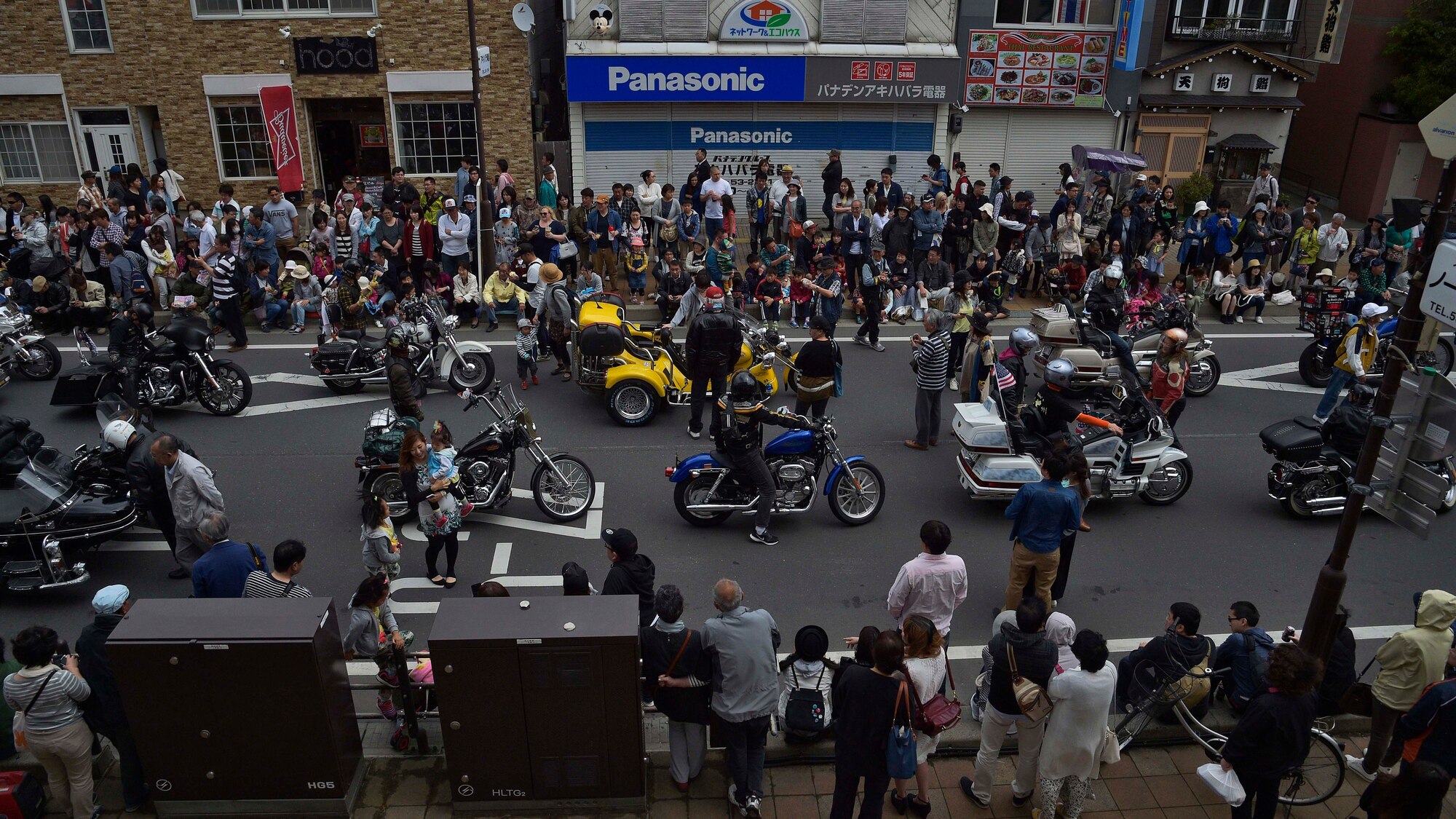 American and Japanese spectators watch as motorcycles fill the streets of Misawa City, Japan, during the 28th Annual American Day parade, June 5, 2016. Events like these are important as they afford Misawa neighbors, American and Japanese alike, opportunities to interact in a relaxed environment specifically planned for building friendships. More than 80,000 attendees from across the Aomori Prefecture traveled to Misawa City to enjoy American and Japanese culture. (U.S. Air Force photo by Senior Airman Deana Heitzman)