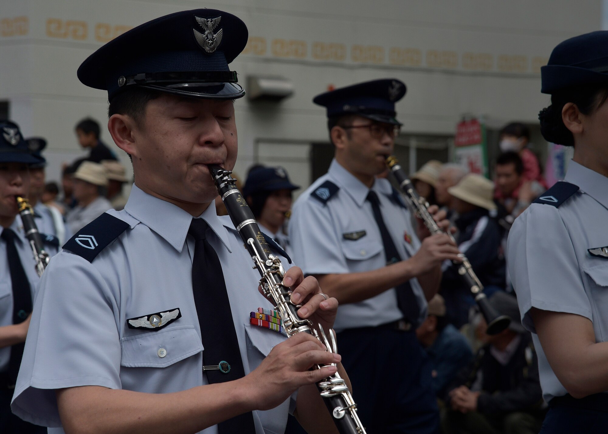 A Japan Air Self-Defense Force band member plays the clarinet during the 28th Annual American Day parade in Misawa City, Japan, June 5, 2016. Events like these are important as they afford Misawa neighbors, American and Japanese alike, opportunities to interact in a relaxed environment specifically planned for building friendships. More than 80,000 attendees from across the Aomori Prefecture traveled to Misawa City to enjoy American and Japanese culture. (U.S. Air Force photo by Senior Airman Deana Heitzman)