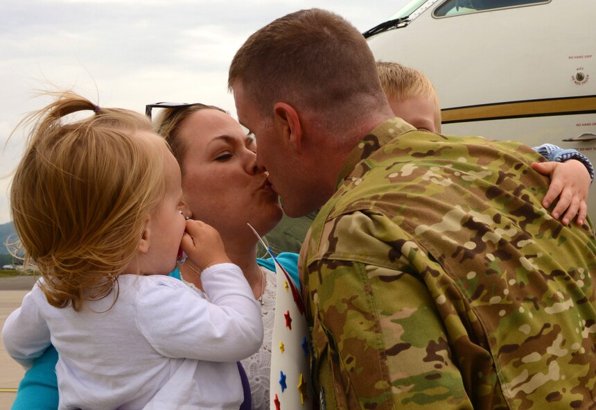 Maj. John T. Field, 76th Airlift Squadron assistant director of operations, meets his family after returning from his deployment June 1, 2016, Ramstein Air Base, Germany. Field served as the director of operations for the deployment. (U.S. Air Force Photo/ Airman 1st Class Joshua Magbanua)