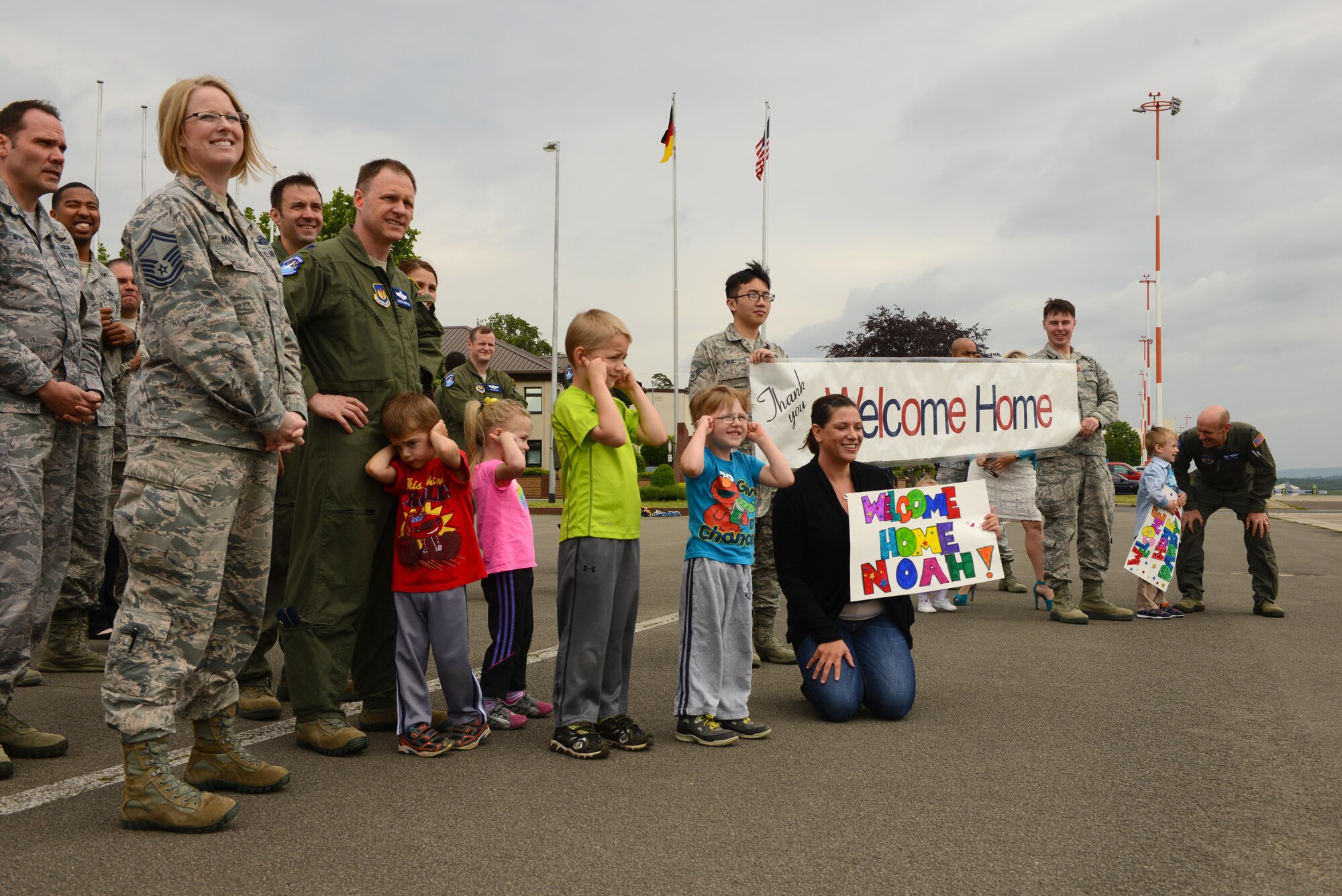 Family members and colleagues of Airmen returning from a deployment await their arrival June 1, 2016,  Ramstein Air Base, Germany. The family members welcomed the Airmen as they disembarked from their C-20H Gulfstream IV aircraft. (U.S. Air Force Photo/ Airman 1st Class Joshua Magbanua) 