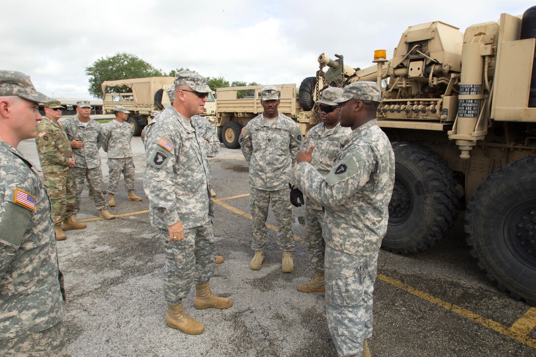 Army Brigadier General Patrick M. Hamilton, center, commander, Domestic Operations, thanks soldiers for their service before search-and-rescue operations begin in Rosenberg, Texas, June 3, 2016. Texas Army National Guard photo by Staff Sgt. Timothy Pruitt