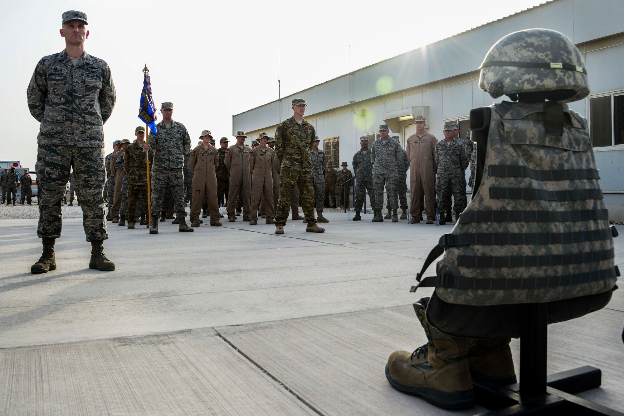 Members of the 379th Air Expeditionary Wing gather for a Memorial Day ceremony May 30, 2016, at Al Udeid Air Base, Qatar. Memorial Day, originally called Decoration Day, is a day of remembrance for those who have died in service of the United State of America. The day originated in the years following the Civil War to honor those who died while in military service. (U.S. Air Force photo/Senior Airman Janelle Patiño/Released)