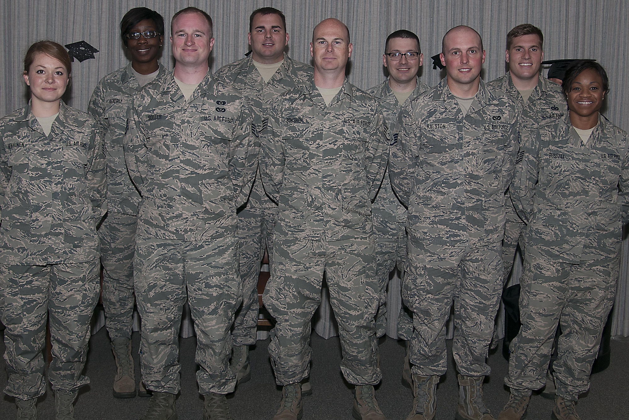 Community Collage of the Air Force graduates pose for a photo during a CCAF graduation ceremony at Grissom Air Reserve Base, Ind., June 5, 2016. The college annually awards over 22,000 associate degrees from 68 degree programs to Air Force members. (U.S. Air Force Photo/Senior Airman Dakota Bergl)
