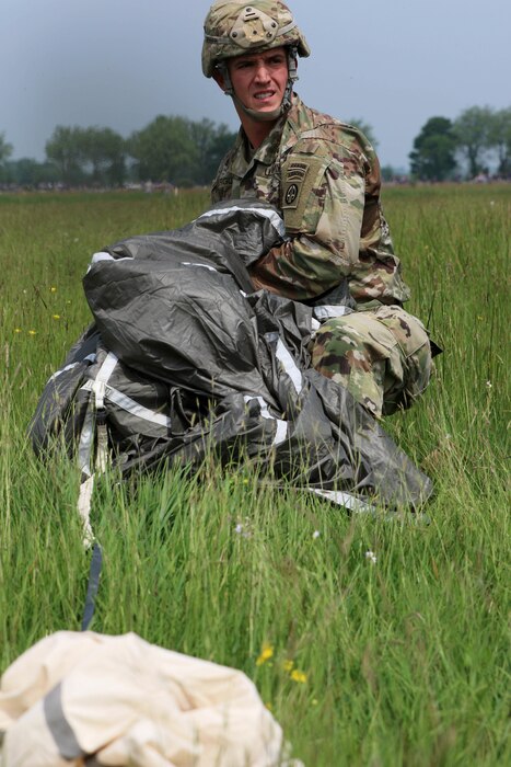 Paratroopers from France, Germany and America's 82nd Airborne Division walk off the drop zone together after their parachute jump over Sainte Mere Eglise, France on June 5, 2016, to commemorate the 72nd anniversary of D-Day. U.S. Army photo by Capt. Joe Bush