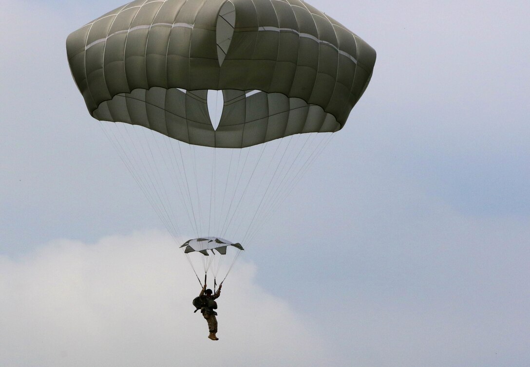 Paratroopers from three countries jumped over Sainte Mere Eglise, France, June 5, 2016, to commemorate the 72nd anniversary of D-Day. The soldiers were greeted with love and hospitality by the people of the Normandy region. U.S. Army photo by Capt. Joe Bush