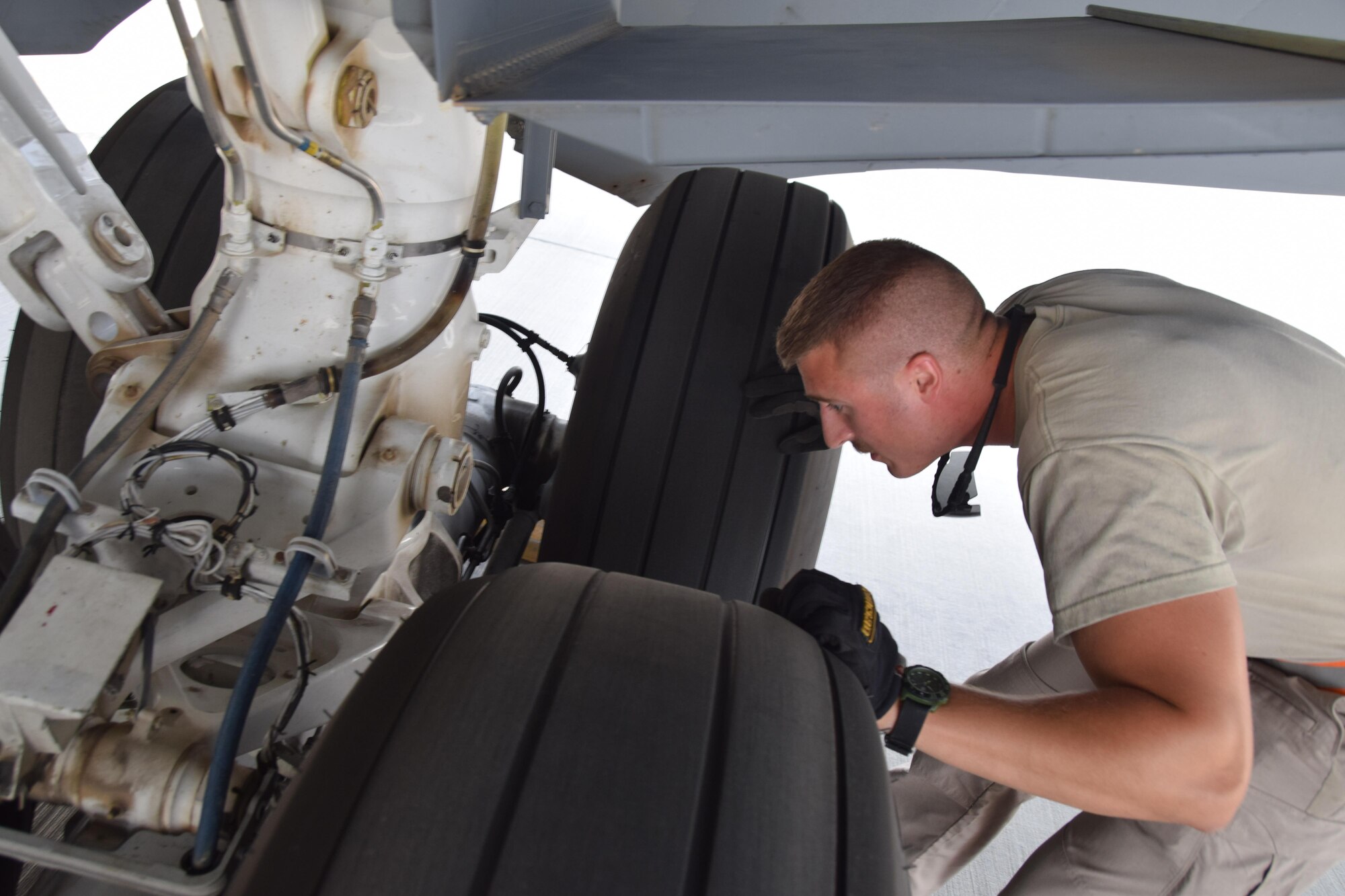 Staff Sgt. Ryan Feeney, 340th Expeditionary Aircraft Maintenance Unit crew chief, inspects the landing gear on a KC-135 Stratotanker prior to a mission June 1, 2016, at Al Udeid Air Base, Qatar. KC-135 maintainers work behind the scenes to enable the success of the air refueling mission across the theater. The 340th AMU here maintains the largest KC-135 fleet in the world, launching more than 30 KC-135s daily in support of Operation Inherent Resolve and other theater requirements. Feeney is attached to the 379th Air Expeditionary Wing and hails from Bangor Air National Guard Base, Maine. (U.S. Air Force photo by Technical Sgt. Carlos J. Trevino/Released)