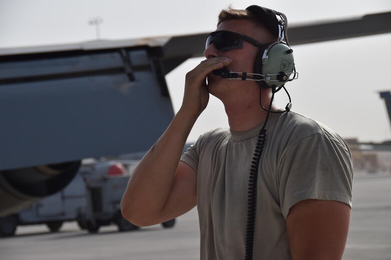 Staff Sgt. Ryan Feeney, 340th Expeditionary Aircraft Maintenance Unit crew chief, communicates with a KC-135 Stratotanker air crew prior to a mission June 1, 2016, at Al Udeid Air Base, Qatar. The KC-135 delivers fuel to aircraft flying combat air patrols and other missions across the theater, which enhances the Air Force’s capability to accomplish its primary mission of global reach and saves coalition lives every day. Feeney is attached to the 379th Air Expeditionary Wing and hails from Bangor Air National Guard Base, Maine. (U.S. Air Force photo by Technical Sgt. Carlos J. Trevino/Released)