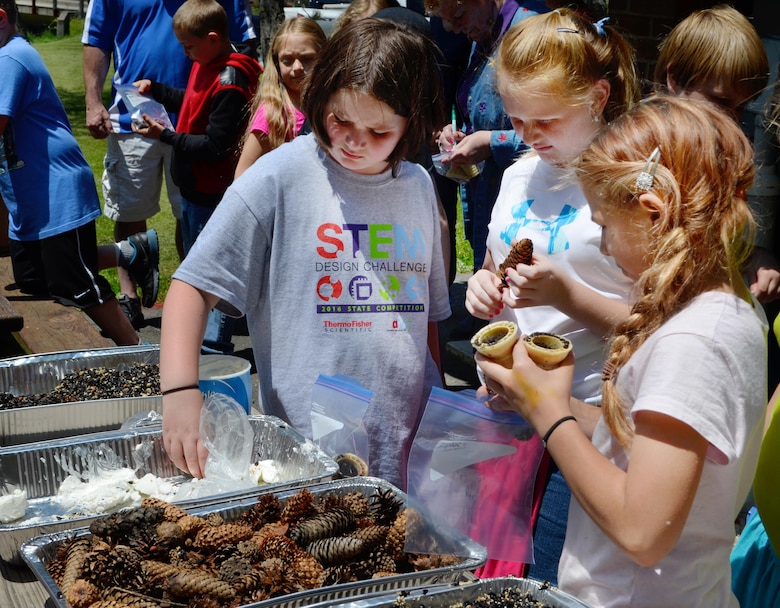 Fourth grade students from Blossburg Elementary School make pine cone bird feeders at Tioga-Hammond and Cowanesque Lakes, May 24, 2016.  The Corps project was one of 186 federal sites selected to receive a 2015 field trip grant from the National Park Foundation (NPF), the official charity of America’s national parks. The grant, part of NPF’s Open OutDoors for Kids Program, supports the White House’s Every Kid in a Park youth initiative, which provides  fourth-grade children and their families a pass granting free access to national parks, forests, and wildlife refuges.