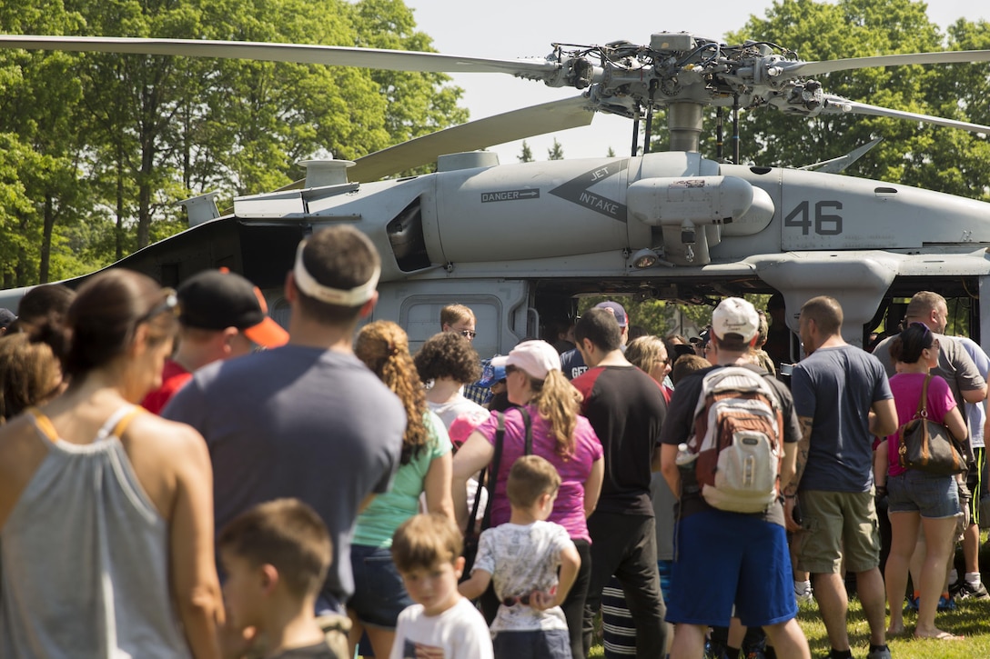 New Yorkers wait in line to tour a military aircraft during a static display as part of Fleet Week at Eisenhower Park, in East Meadow, New York, May 28, 2016. U.S. Marines and sailors are visiting to interact with the public, demonstrate capabilities and teach the people of New York about America's sea services. (U.S. Marine Corps photo by 24th MEU Combat Camera Lance Cpl. Hernan Vidana/Released)