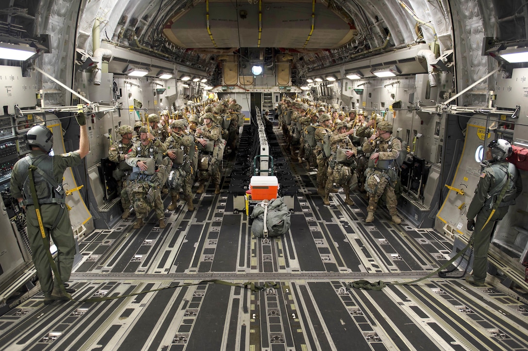 Army paratroopers and Air Force airmen prepare for a static line airdrop from an Air Force C-17 Globemaster III during exercise Crescent Reach 16 over a drop zone at Fort Bragg, N.C., May 26, 2016. The airmen are assigned to the 315 Airlift Wing. Air Force photo by Tech. Sgt. Jason Robertson