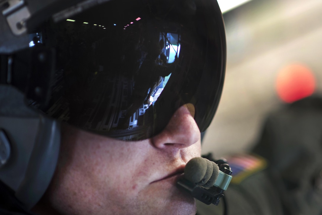 Air Force Tech. Sgt. Brian Chaney watches as paratroopers prepare to perform a static line airdrop from an Air Force C-17 Globemaster III during exercise Crescent Reach 16 over a drop zone at Fort Bragg, N.C., May 26, 2016. Air Force photo by Tech. Sgt. Jason Robertson