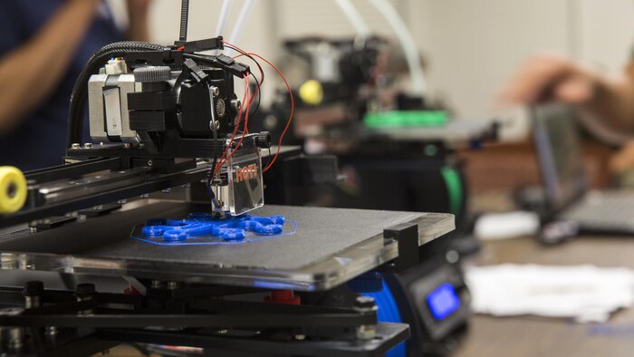 Marines from various units learn how to setup and print designs using an Invent3D printer during a class at Marine Corps Base Camp Lejeune, North Carolina, June 2, 2016. Additive manufacturing, or 3D printing, allows Marines to produce parts quickly, with exact specifications and at almost any location.  