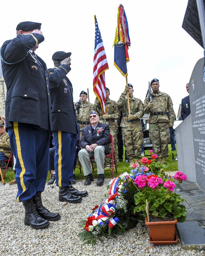 U.S. Army Col. Al Boyer, left, commander of the 101st Airborne Division’s 1st Brigade Combat Team, and U.S. Army Command Sgt. Maj. James Manning, senior enlisted advisor, 1st Brigade Combat Team, render salutes to the memorial dedicated to U.S. Army veterans Kenneth Moore and Robert Wright in Angoville au Plain, France, June 4, 2016. Air Force photo by Staff Sgt. Timothy Moore 