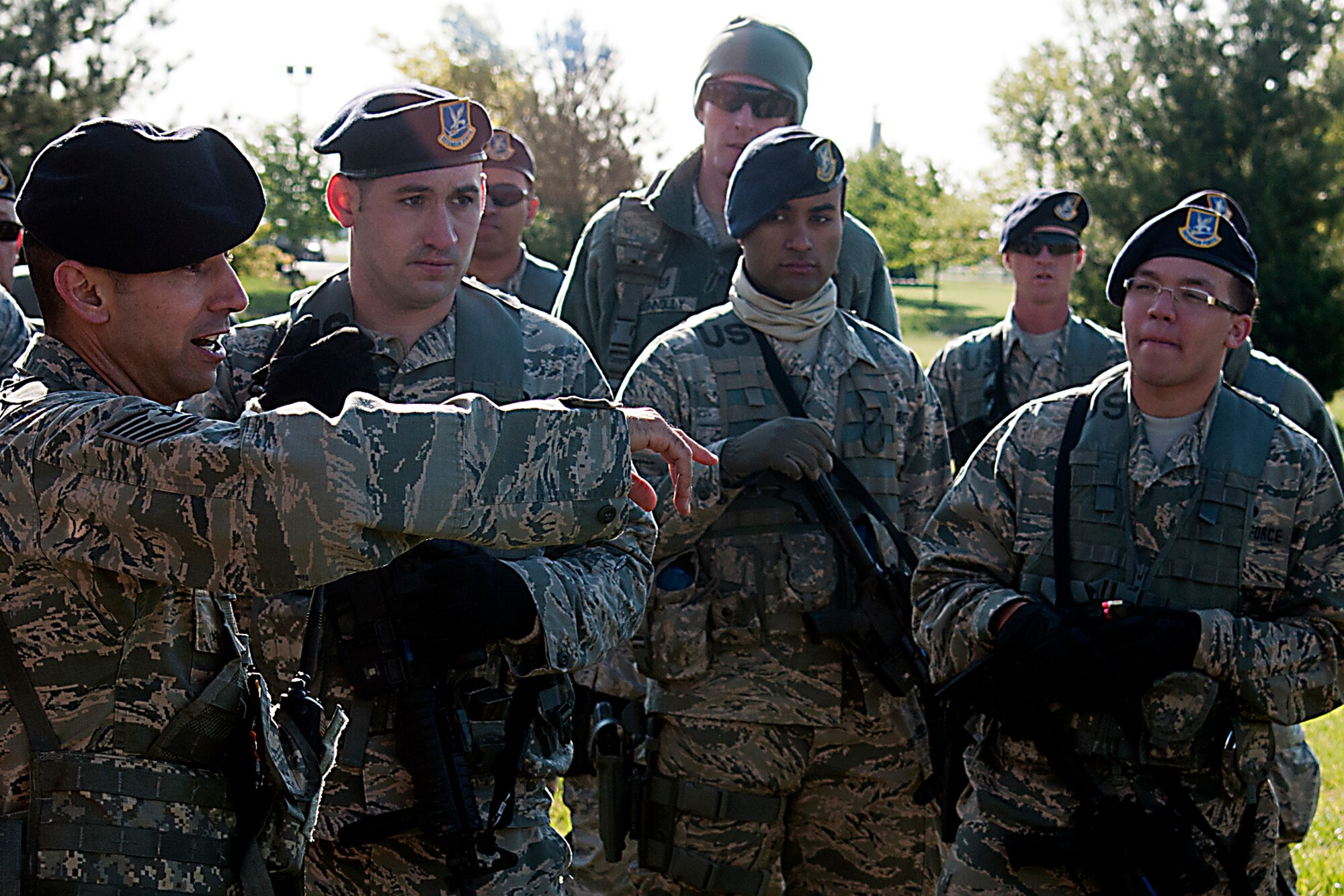 Tech. Sgt. James Marshall, 434th Security Forces Squadron tire team leader, gives a safety briefing to his teammates before a Shoot, Move, Communicate exercise May 15, 2016 at Grissom Air Reserve Base, Ind. The exercise is designed to allow SFS members to practice communicating during a simulated firefight. (U.S. Air Force photo/Senior Airman Dakota Bergl)