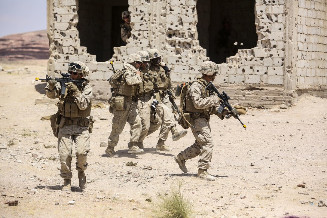 Marines with 1st Battalion, 2nd Marine Regiment, 2nd Marine Division evacuate a simulated casualty during the Eager Lion 16 final exercise in Al Quweyrah, Jordan, May 24, 2016. Eager Lion is a recurring exercise between partner nations designed to strengthen military-to-military relationships, increase interoperability, and enhance regional security and stability. (U.S. Marine Corps photo by Cpl. Paul S. Martinez/Released)