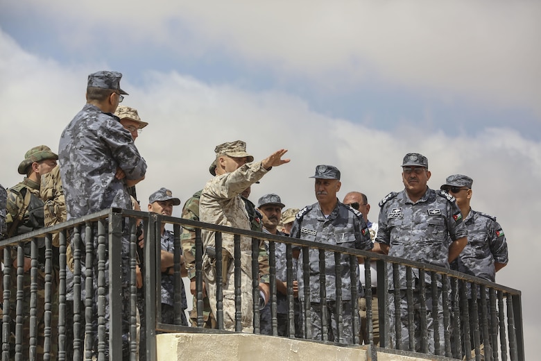 Lieutenant Col. Eric Reid, center, commanding officer of 1st Battalion, 2nd Marine Regiment, 2nd Marine Division, explains the scheme of maneuver to Royal Jordanian Navy officers during the final exercise of Eager Lion 16 in Al Quweyrah, Jordan, May 24, 2016. Eager Lion is a recurring exercise between partner nations designed to strengthen military-to-military relationships, increase interoperability, and enhance regional security and stability. (U.S. Marine Corps photo by Cpl. Paul S. Martinez/Released)