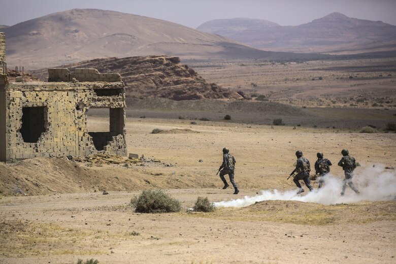 Members of the Jordanian 77th Marines Battalion advance down range during the Eager Lion 16 final exercise in Al Quweyrah, Jordan, May 24, 2016. Eager Lion is a recurring exercise between partner nations designed to strengthen military-to-military relationships, increase interoperability, and enhance regional security and stability. (U.S. Marine Corps photo by Cpl. Paul S. Martinez/Released)