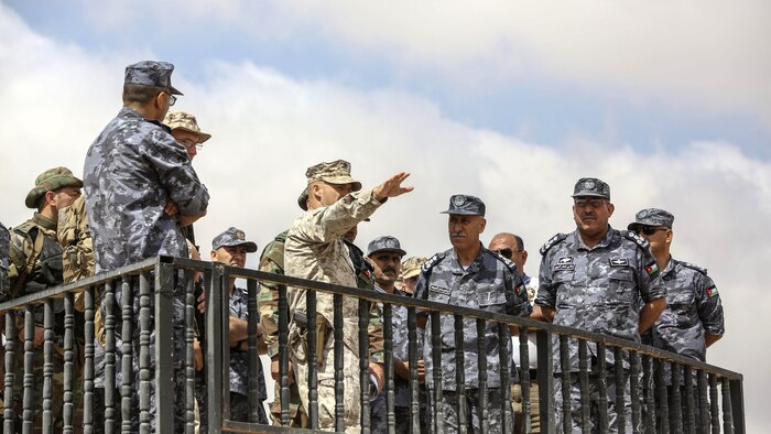 Lt. Col. Eric Reid, center, commanding officer of 1st Battalion, 2nd Marine Regiment, 2nd Marine Division, explains the scheme of maneuver to Royal Jordanian Navy officers during the final exercise of Eager Lion 16 in Al Quweyrah, Jordan, May 24, 2016. Eager Lion is a recurring exercise between partner nations designed to strengthen military-to-military relationships, increase interoperability, and enhance regional security and stability. 