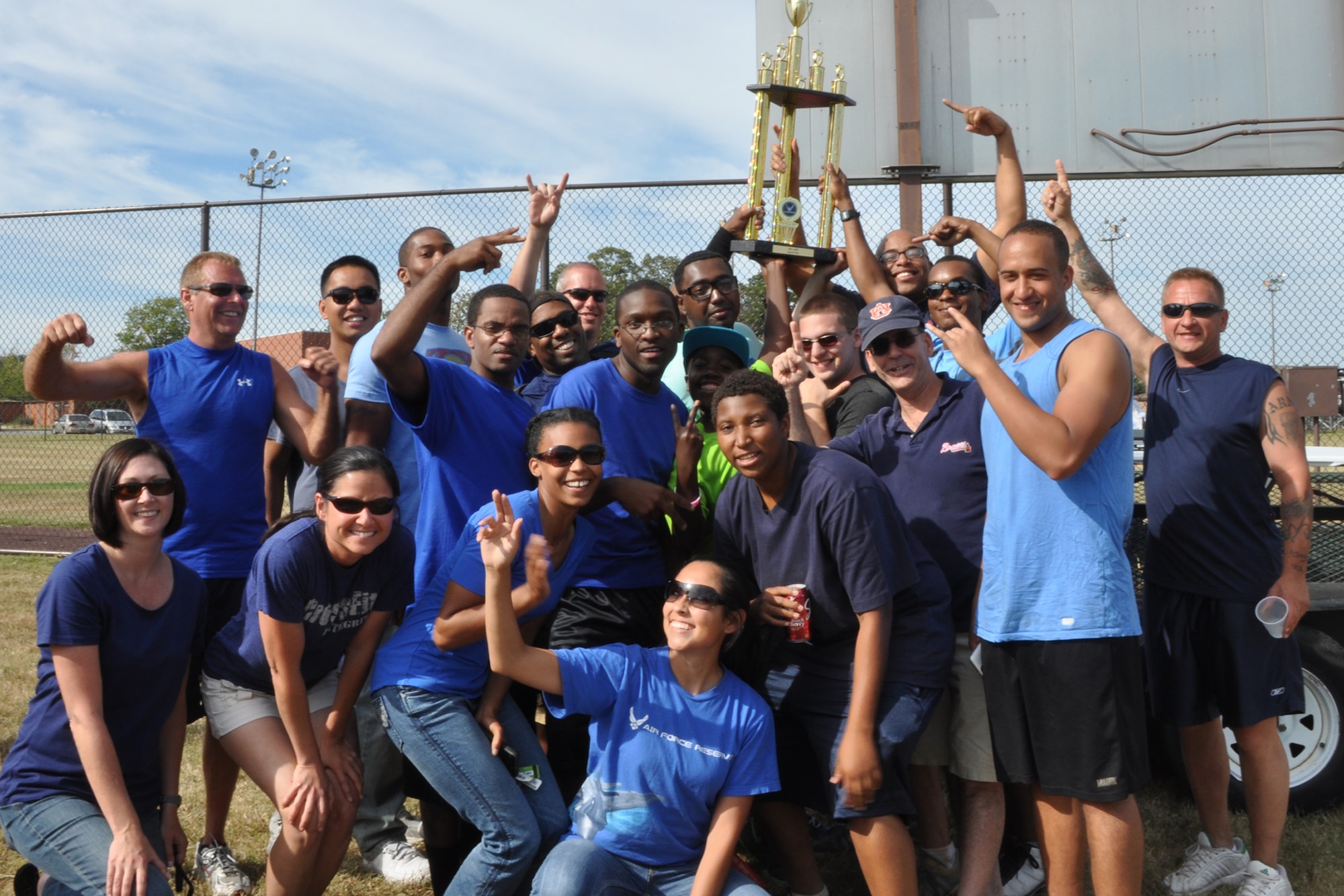 Members from the 459th Maintenance Group pose for a picture after being declared winners of the sports and family day at Joint Base Andrews, Md., September 15, 2013. This is the second year in a row the trophy went to MXG. (U.S. Air Force photo/ Staff Sgt. Katie Spencer)  