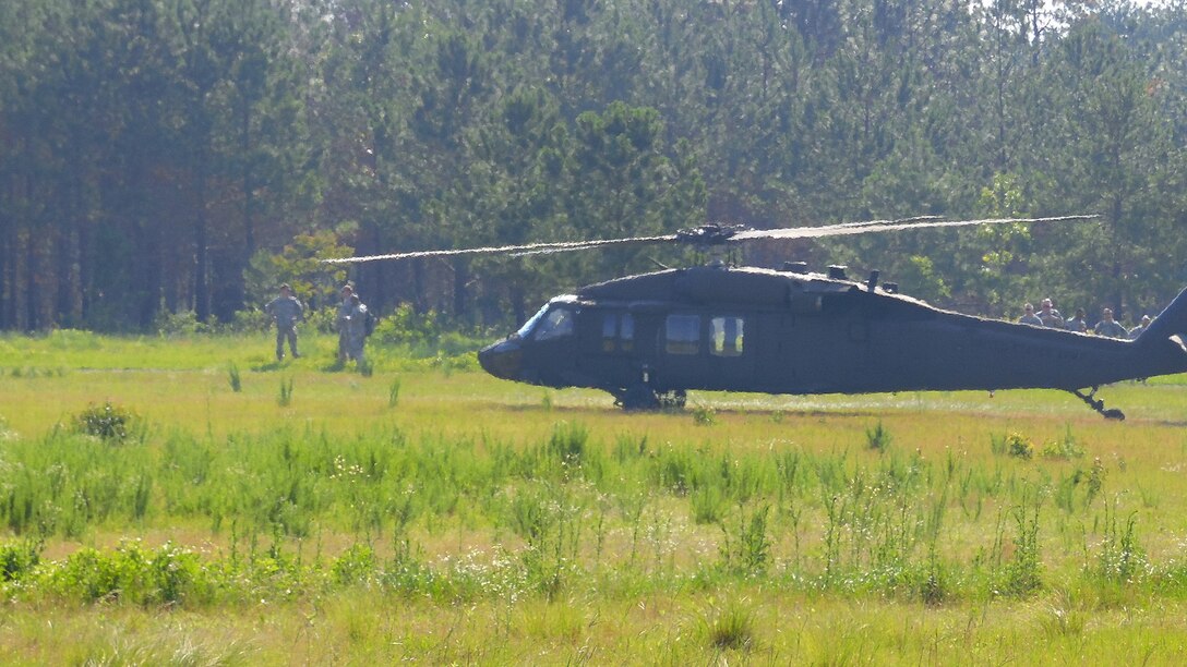 Soldiers assigned to the U.S. Army Reserve Command Augmentation Unit (UAU) arrive at a landing zone aboard Army Reserve UH-60 Black Hawk helicopters assigned to A Company 1st Battalion, 169th Aviation Regiment to perform a land navigation and orienteering exercise during their Battle Assembly on June 4, 2016, at Fort Bragg, N.C. The training required soldiers to navigate to fixed points using a compass, map and protractor.
The mission of the UAU is to augment United States Army Reserve Command staff during exercises, crisis actions, or a presidential selective reserve call-up. Soldiers of the UAU train regularly to provide the most qualified, trained, and prepared Soldiers upon request by Army units. (U.S. Army photo by Lt. Col. Kristian Sorensen/released)