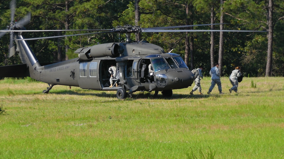 Soldiers assigned to the U.S. Army Reserve Command Augmentation Unit (UAU) arrive at a landing zone aboard Army Reserve UH-60 Black Hawk helicopters assigned to A Company 1st Battalion, 169th Aviation Regiment to perform a land navigation and orienteering exercise during their Battle Assembly on June 4, 2016, at Fort Bragg, N.C. The training required soldiers to navigate to fixed points using a compass, map and protractor.
The mission of the UAU is to augment United States Army Reserve Command staff during exercises, crisis actions, or a presidential selective reserve call-up. Soldiers of the UAU train regularly to provide the most qualified, trained, and prepared Soldiers upon request by Army units. (U.S. Army photo by Lt. Col. Kristian Sorensen/released)
